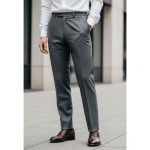 A person wearing a perfectly fitted white shirt and tailored straight-leg trousers, showing balanced proportions for an effortlessly stylish outfit